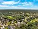 Breathtaking aerial view of the community highlighting neighborhood layout, and lush landscapes on a beautiful sunny day at 5383 Firethorn Pt, Spring Hill, FL 34609
