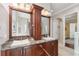 A large bathroom with granite countertops and custom cabinets at 5383 Firethorn Pt, Spring Hill, FL 34609