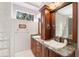 Double vanity sinks with granite countertops, and custom cabinets in the bathroom at 5383 Firethorn Pt, Spring Hill, FL 34609