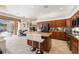 Kitchen with island, stainless steel appliances, and view of the pool at 5383 Firethorn Pt, Spring Hill, FL 34609