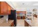 Kitchen featuring wooden cabinets, granite counters, and stainless steel appliances at 5383 Firethorn Pt, Spring Hill, FL 34609