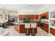 Kitchen with a large island with seating and stainless steel appliances at 5383 Firethorn Pt, Spring Hill, FL 34609