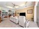 Open-concept living room with tile floors and comfortable seating arrangement at 5383 Firethorn Pt, Spring Hill, FL 34609