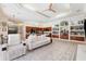 Bright, open-concept living room and kitchen space with tile flooring at 5383 Firethorn Pt, Spring Hill, FL 34609