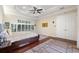 A spacious main bedroom features tray ceilings and ample natural light at 5383 Firethorn Pt, Spring Hill, FL 34609
