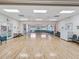 Large meeting room showcasing hardwood floors and white walls, ideal for events and gatherings at 5383 Firethorn Pt, Spring Hill, FL 34609