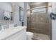 Well-lit bathroom featuring modern sink, shower with glass doors, and contemporary fixtures at 5731 Summit View Dr, Brooksville, FL 34601