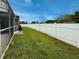 Spacious backyard featuring a well-manicured lawn and a sturdy privacy fence at 5801 65Th N Ter, Pinellas Park, FL 33781
