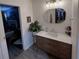 Bright bathroom featuring a modern vanity with a stylish mirror and neutral color palette at 5801 65Th N Ter, Pinellas Park, FL 33781