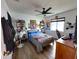 Cozy bedroom with a ceiling fan, hardwood floors, and a window letting in plenty of light at 5801 65Th N Ter, Pinellas Park, FL 33781