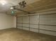 Spacious two car garage featuring ample space and a gray door at 5801 65Th N Ter, Pinellas Park, FL 33781