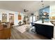Inviting living space featuring a kitchen island with bar seating and open access to dining area at 5801 65Th N Ter, Pinellas Park, FL 33781
