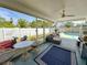 Enclosed lanai featuring a seating area, ceiling fan, and direct access to the screened in pool at 5801 65Th N Ter, Pinellas Park, FL 33781