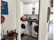 Bright laundry room with updated appliances, sleek cabinets, and lots of counter space at 5801 65Th N Ter, Pinellas Park, FL 33781