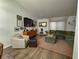 Cozy living room featuring comfortable seating, stylish decor, and a bright airy feel at 5801 65Th N Ter, Pinellas Park, FL 33781