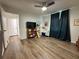 Inviting living room with hardwood floors, large windows, and a comfortable area to relax at 5801 65Th N Ter, Pinellas Park, FL 33781