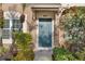 Inviting front door entrance with lush landscaping and clear unit number at 6027 Bayside Key Dr, Tampa, FL 33615