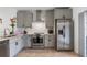 Beautiful kitchen featuring stainless steel appliances, and gray cabinetry at 6027 Bayside Key Dr, Tampa, FL 33615