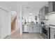 Modern kitchen with stainless steel appliances and seamless connectivity to living areas at 6027 Bayside Key Dr, Tampa, FL 33615