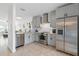 Bright kitchen features stainless steel appliances, light gray cabinets, and granite countertops at 6027 Bayside Key Dr, Tampa, FL 33615