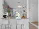 Modern kitchen with granite countertops, breakfast bar, and sliding glass doors at 6027 Bayside Key Dr, Tampa, FL 33615