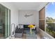 Inviting screened lanai with gray wicker furniture and peaceful water views at 6027 Bayside Key Dr, Tampa, FL 33615