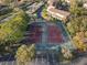 Aerial shot of the tennis courts shows the asphalt surface and the surrounding landscape at 6027 Bayside Key Dr, Tampa, FL 33615