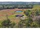 Aerial shot shows house, pond and surrounding land at 6413 Emerson Rd, Brooksville, FL 34601