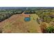 Gorgeous rural land with a pond surrounded by expansive greenery and scenic beauty at 6413 Emerson Rd, Brooksville, FL 34601