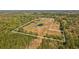 Aerial shot highlighting the property's acreage, surrounded by lush greenery and trees at 6413 Emerson Rd, Brooksville, FL 34601