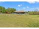 Expansive backyard includes a screened-in porch and plenty of room for outdoor activities at 6413 Emerson Rd, Brooksville, FL 34601