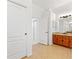 Bathroom with tile floors and double doors to bedrooms at 6413 Emerson Rd, Brooksville, FL 34601