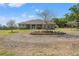 Inviting single-story home with a circular driveway and well-maintained landscaping at 6413 Emerson Rd, Brooksville, FL 34601