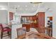 Modern kitchen with stainless steel appliances, granite countertops and breakfast bar with seating at 6413 Emerson Rd, Brooksville, FL 34601