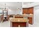 Kitchen features center island, breakfast nook and view of living area at 6413 Emerson Rd, Brooksville, FL 34601