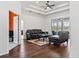 Living room with hardwood floors, tray ceilings and sliding glass doors to outdoor space at 6413 Emerson Rd, Brooksville, FL 34601