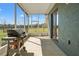 This screened-in patio has a grill, overlooks the backyard, and is perfect for enjoying outdoor living at 6413 Emerson Rd, Brooksville, FL 34601