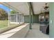 The screened-in patio offers plenty of room for outdoor seating overlooking the yard at 6413 Emerson Rd, Brooksville, FL 34601