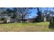This large grassy backyard features a chicken coop at 6825 Main St, New Port Richey, FL 34653