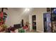 Bedroom with neutral walls and flooring, open closet and connected bathroom; needs TLC to showcase its full potential at 6825 Main St, New Port Richey, FL 34653