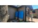 Exterior view showcasing two large blue tanks and brick flooring at 6825 Main St, New Port Richey, FL 34653