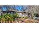 Charming single-story home featuring a well-maintained front yard with lush landscaping and a welcoming entrance at 6825 Main St, New Port Richey, FL 34653