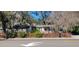 Charming single-story home with a welcoming front porch and well-maintained landscaping at 6825 Main St, New Port Richey, FL 34653