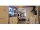 An inviting kitchen featuring white cabinets and a window looking into a combined dining space at 6825 Main St, New Port Richey, FL 34653