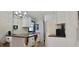 Bright kitchen with a wooden breakfast bar, modern cabinets and a stainless fridge at 6825 Main St, New Port Richey, FL 34653