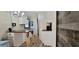 Well-lit kitchen area features a breakfast bar, white cabinets, and modern appliances at 6825 Main St, New Port Richey, FL 34653