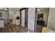 Open-concept living space with a dining area, sliding barn doors, providing a comfortable and functional layout at 6825 Main St, New Port Richey, FL 34653