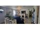 Comfortable living room featuring a decorative fireplace and an abundance of natural light at 6825 Main St, New Port Richey, FL 34653
