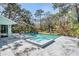 Backyard pool and spa with a spacious deck, perfect for outdoor entertaining at 7065 Red Oak Loop, New Port Richey, FL 34654