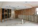 Open basement area with exposed framing and rough-in plumbing, ready for customization at 7308 Mako Dr, Hudson, FL 34667